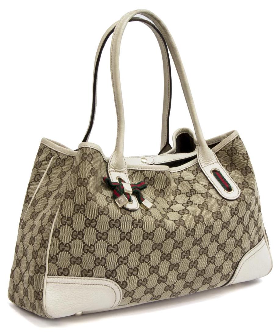 GUCCI GG CANVAS PRINCY MEDIUM TOTE BAG: Gucci Princy medium tote in GG monogram canvas, having gold-tone hardware, beige leather trim and double rolled handles, top opening to lined interior with zipper pocket, some wear to corners and hand
