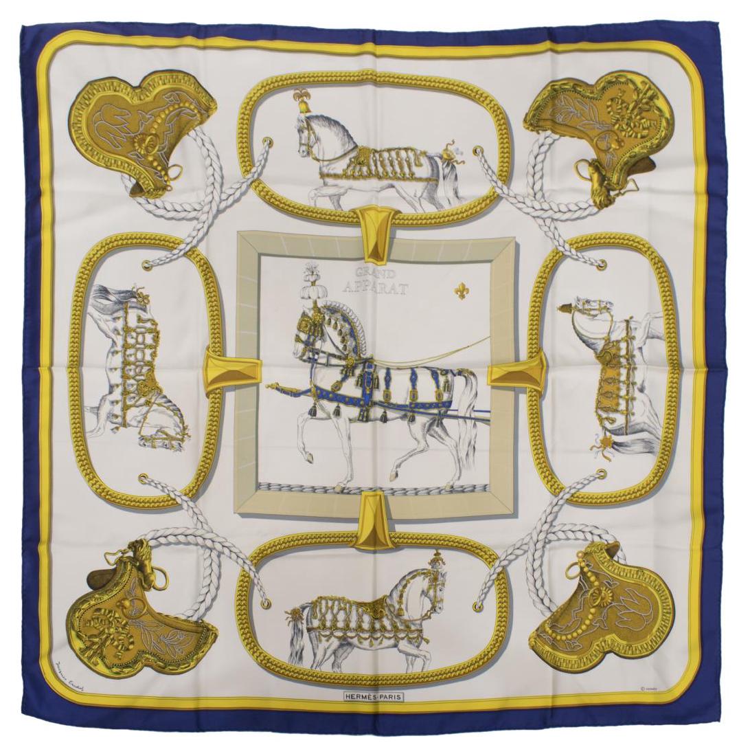 HERMES SILK TWILL 'GRAND APPARAT' SQUARE SCARF: Hermes "Grand Apparat" silk twill square scarf, having a dark blue and yellow border around a pattern of show horses, originally designed by Jacques Eudel, signature lower corner, retaining label and 