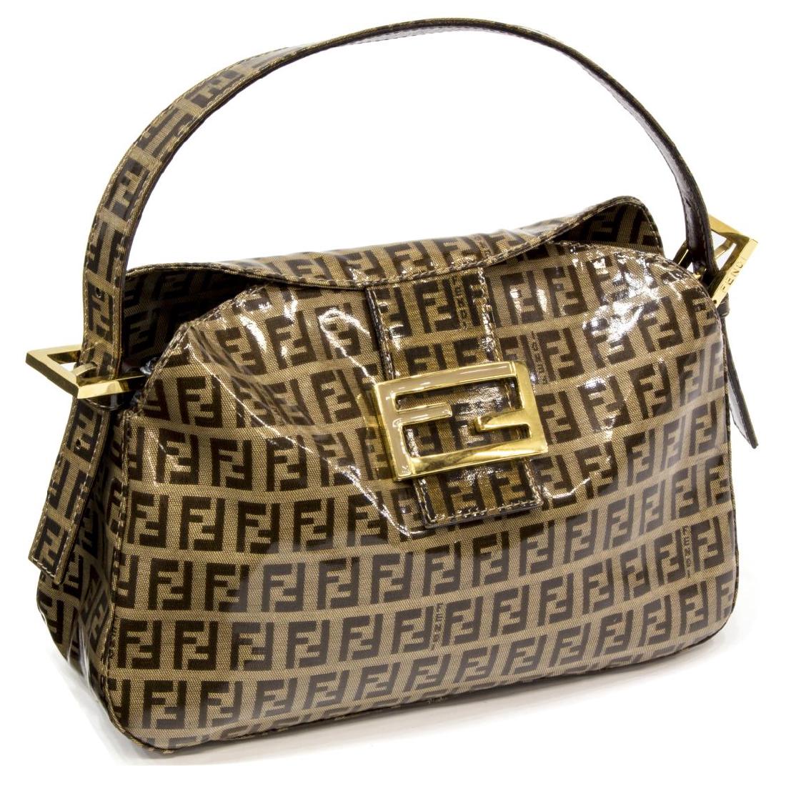 FENDI COATED CANVAS MONOGRAM BAGUETTE BAG: Fendi 'Baguette' handbag in brown monogram coated canvas, gold tone hardware, single shoulder strap, fold-over flap opening to brown lined interior with single zippered pocket, slight surface wear to