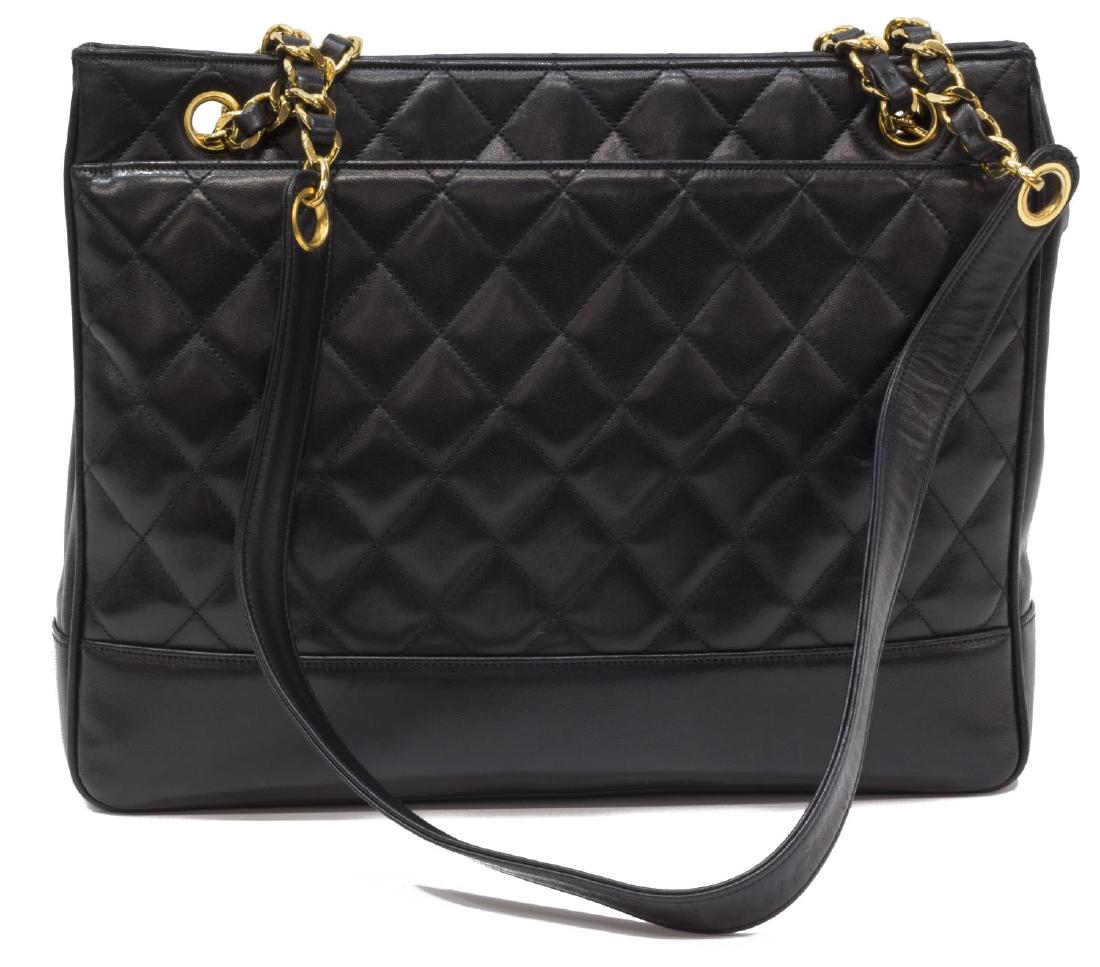 CHANEL QUILTED BLACK LAMBSKIN LEATHER TOTE BAG: Chanel tote shoulder bag in quilted black lambskin leather, having gold tone hardware, duel flat shoulder straps with leather woven chain detail, having full length slot pockets to exterior, snap clos