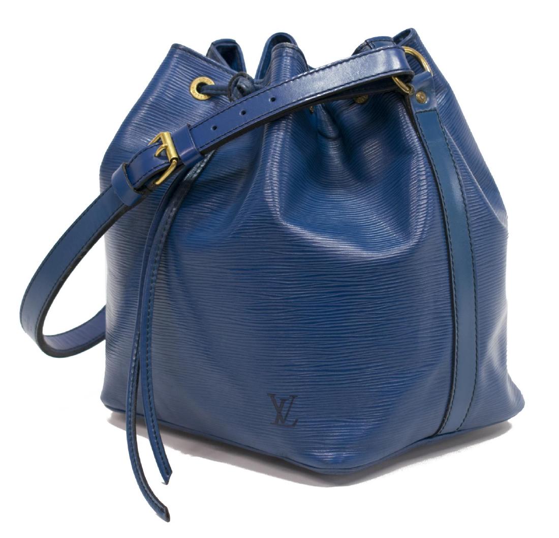 LOUIS VUITTON NOE PM BLUE EPI LEATHER BUCKET BAG: Louis Vuitton "Noe PM" drawstring bucket bag in blue Epi leather with black stitching, leather adjustable strap and trim, gold tone hardware, drawstring top opening to a black lined interior with zipp
