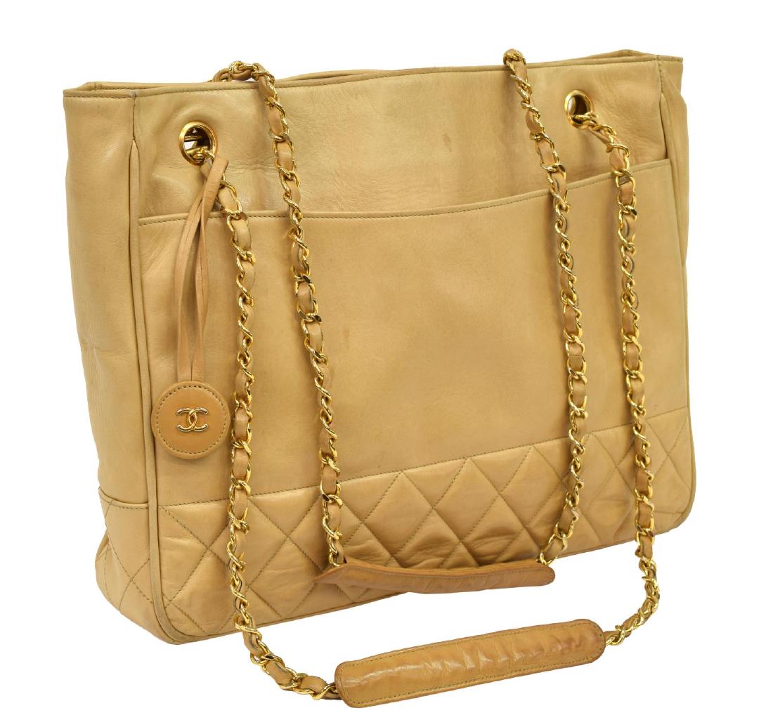 CHANEL QUILTED BASE TAN LEATHER HANDBAG: Chanel tote bag in quilted and smooth tan lambskin leather, gold tone hardware, classic Chanel chain leather dual shoulder straps, snap top opening to interior with two zip pockets, retains Chanel-iss