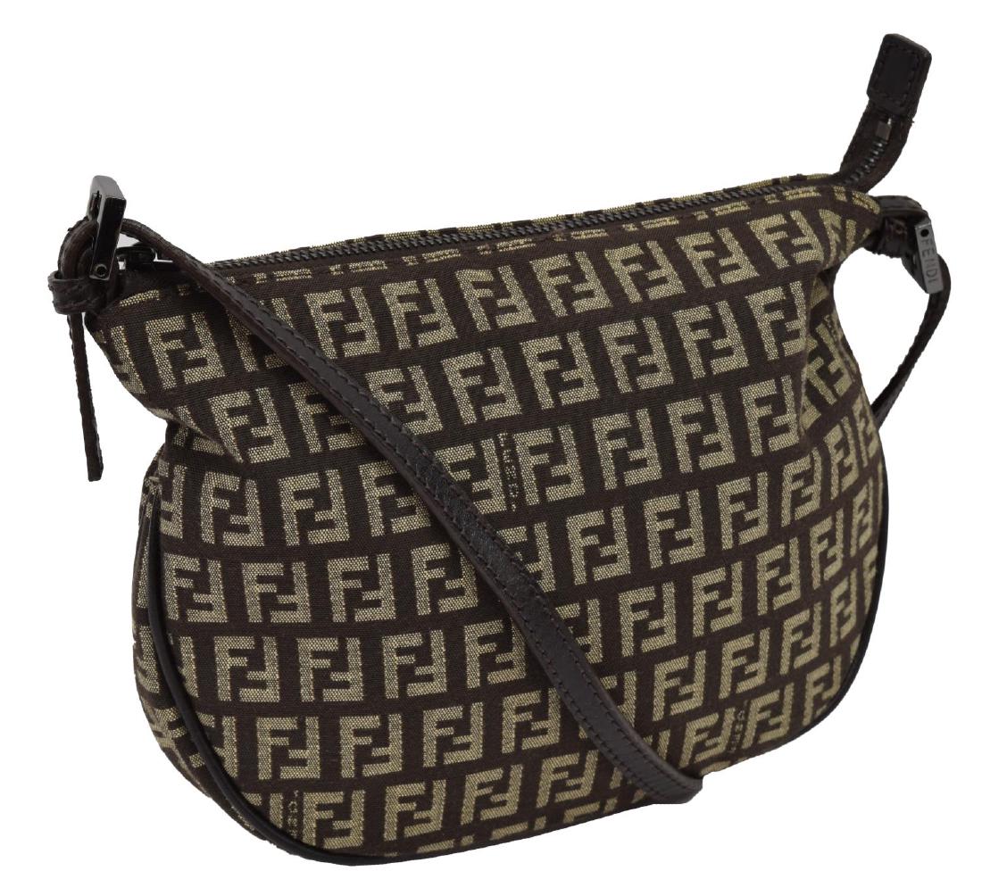 FENDI MONOGRAM CANVAS HANDBAG: Fendi handbag, in monogrammed canvas, ruthenium hardware, an adjustable leather strap above zipper top opening to lined interior with slot pocket, some light wear to fabric, bag: approx 7"h, 9"w, 1.5"
