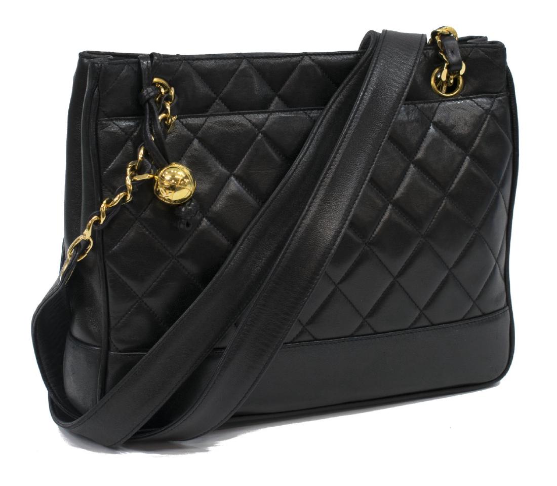 CHANEL BLACK QUILTED LEATHER CHAIN TOTE BAG: Chanel tote bag in quilted black lambskin leather, with gold tone hardware including quilted ball zipper pull, classic chain leather straps, magnetic clasp opening leather lined interior, exterior fla