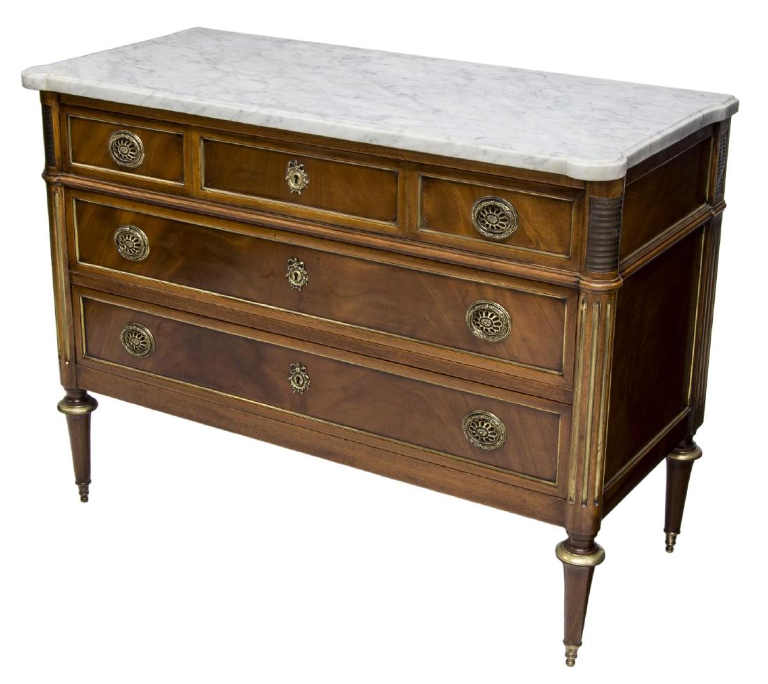 LOUIS XVI STYLE MARBLE TOP COMMODE: Louis XVI style mahogany commode, France, c. 1900, having a marble top over three drawers, rising on turned tapered legs with brass feet, 32"h, 42.75"w, 17"d Start Price: $250.00