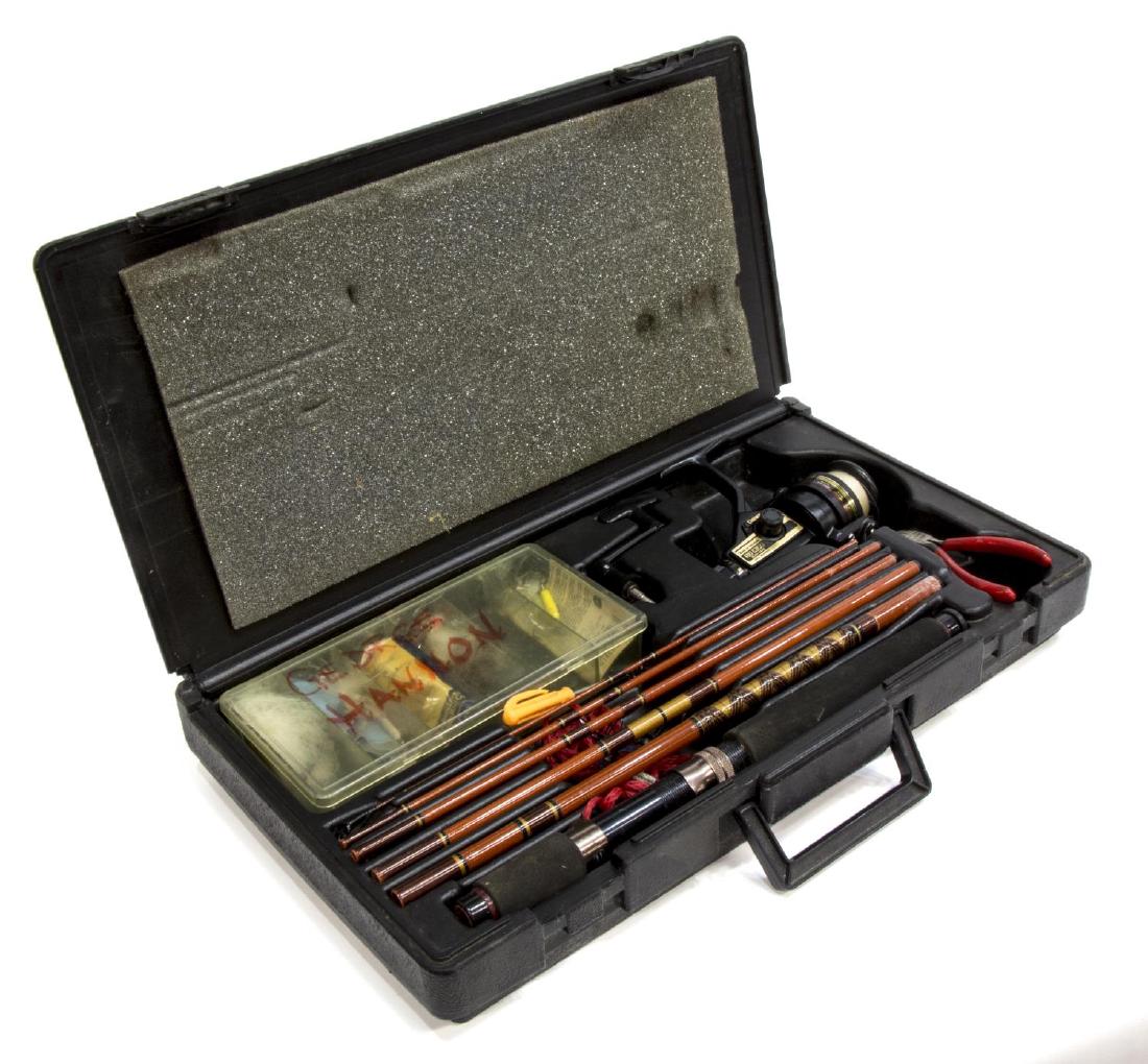 DAIWA 7052 FISHING ROD & RG 1350 SPINNING REEL: Group of fishing gear, including: (1) Daiwa V.I.P. Gold 7052 rod, in six pieces, light action, 6'6" long; (1) Daiwa RG 1350 spinning reel; accompanied by a fitted hard case, with tackle box, lures, to