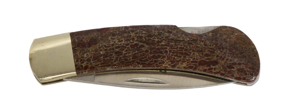 SANTA FE STONEWORKS POCKET KNIFE, DINOSAUR HANDLE: Pocket knife, Sante Fe Stoneworks, Dino Ltd., dinosaur handle, single 2.25" blade, original box **Provenance: The living estate of Coach George Hannon (Kemp, Texas, b. 1924) and Mrs. Hannon. Mr. Hanno