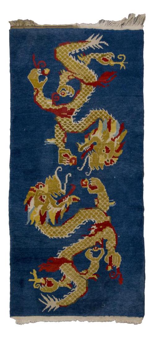 TIBETAN WOOL RUG WITH DRAGONS, 2'9" x 4'9": Tibetan wool rug, with blue ground, two red and gold dragons, some wear and loss to fringe, approx 2'9" x 4'9" **Provenance: The living estate of Coach George Hannon (Kemp, Texas, b. 1924) and Mrs. Ha