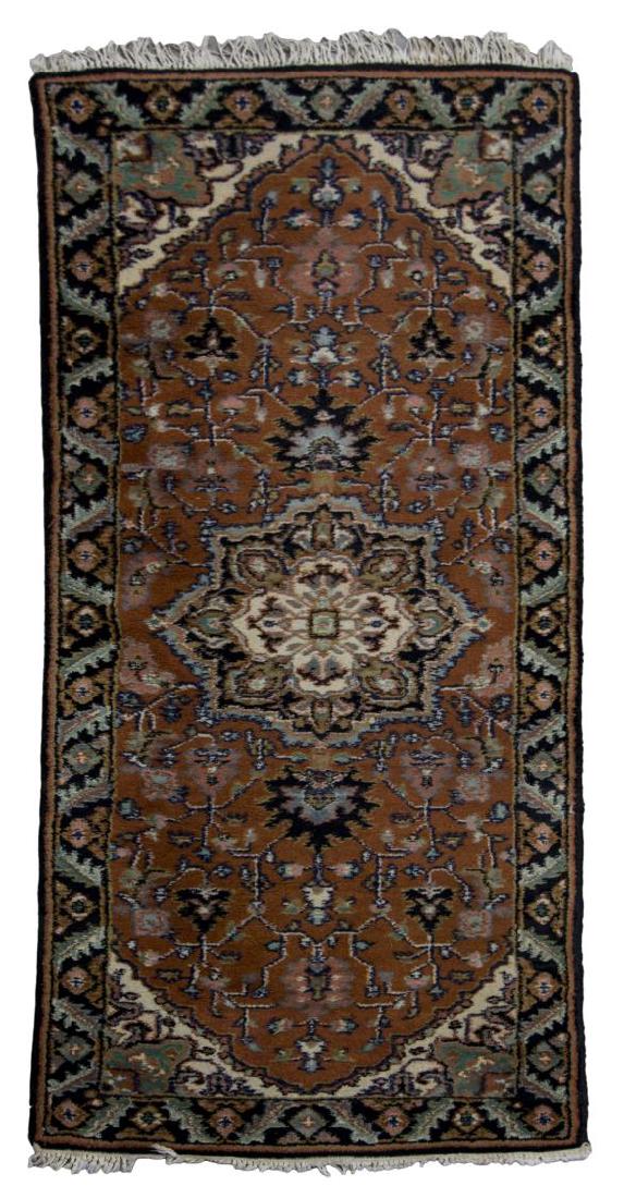 HAND-WOVEN WOOL RUNNER RUG, 2'5" x 6'2": Hand-woven wool runner rug, with rust ground and center medallion, some loss to fringe, approx 2'5" x 6'2" **Provenance: The living estate of Coach George Hannon (Kemp, Texas, b. 1924) and Mrs. Hannon