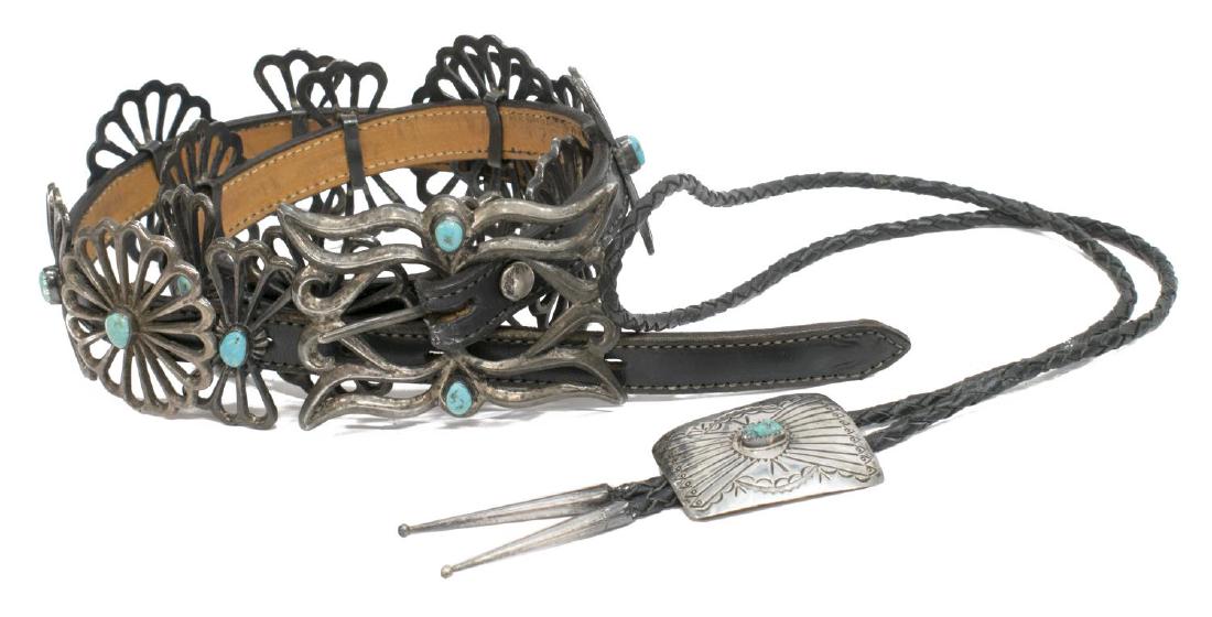 (2) SOUTHWEST TURQUOISE CONCHO BELT & BOLA: (lot of 2) Southwest silver and turquoise concho belt and bolo: (1) concho style belt, leather belt size 32, having openwork buckle and (15) stylized conchos, all set with turquoise stone cabochons, a