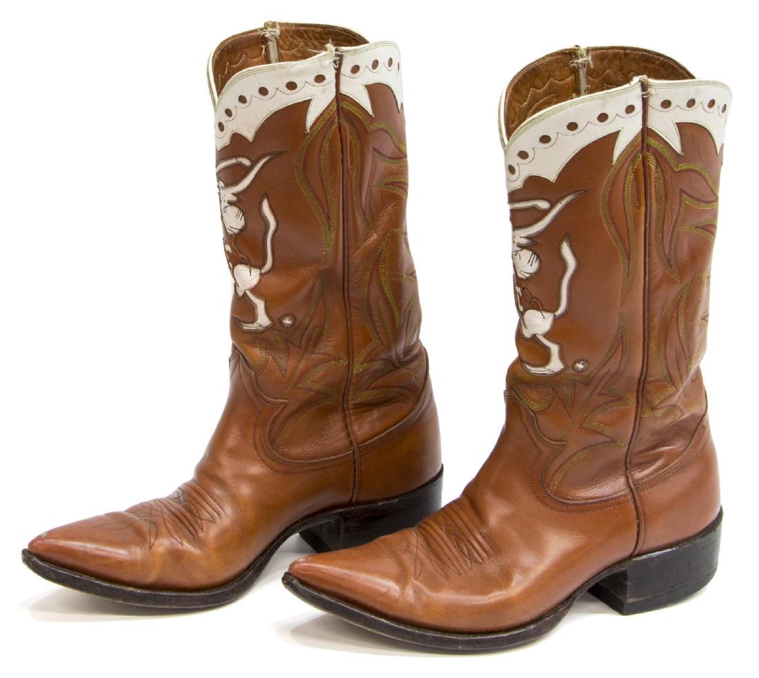 MEN'S UNIVERSITY OF TEXAS LEATHER COWBOY BOOTS: (pair) Custom men's leather cowboy boots, with University of Texas golf team logo, Bevo swinging a club, no size visible, approx 11.25"l, 4"w (exterior), 3lbs **Provenance: The living estate of Coach