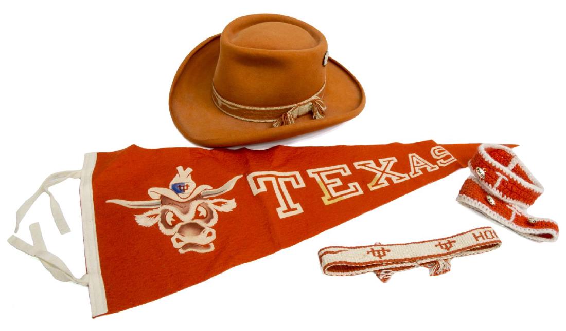 (5) VINTAGE UNIVERSITY OF TEXAS ACCESORIES: (lot of 5) Vintage University of Texas accessories, including: (1) felt pennant, orange ground, with white letters and Bevo logo, some staining, 28.5"l; (1) woven hat band, 1"h, 22"l; (2) crochet arm 