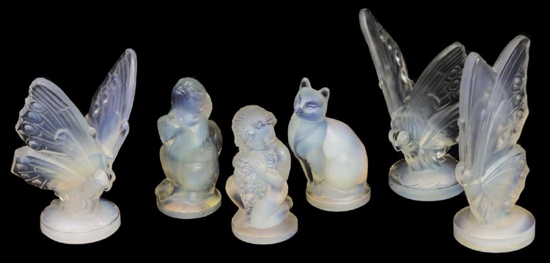 (6) SABINO ART GLASS PUTTI, BUTTERFLIES, DOG & CAT: (lot of 6) French Sabino opalescent art glass figures, including (3) butterflys, (two) with open wings, (1) seated cat, (1) begging pup, (1) kneeling putti with floral garland, incised marks, one reta