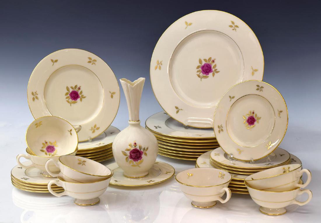 (38)LENOX RHODORA PARCEL GILT PORCELAIN DINNER SET: (set of 38) Lenox "Rhodora" parcel gilt porcelain (partial) dinner service, centering a deep pink flower, comprising: (9) dinner plates, 10.5"diam; (12) salad plates, one with minute chip underfoot, 8