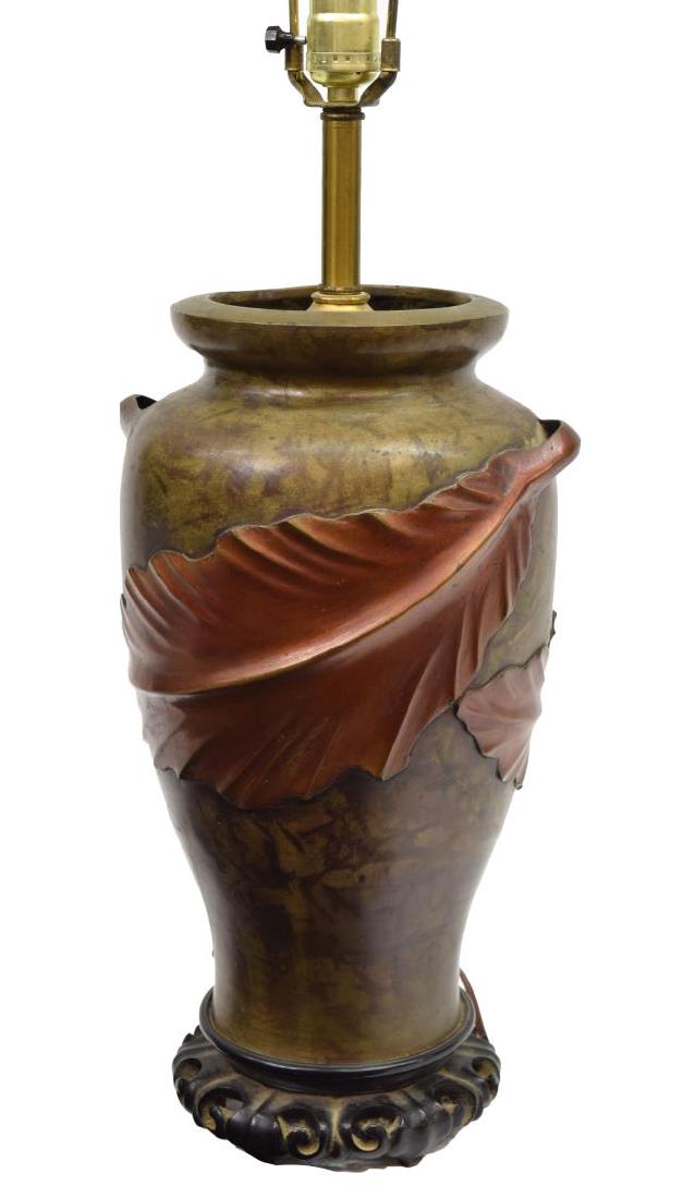 CHINESE BRONZE URN ON HARDWOOD BASE TABLE LAMP: Chinese table lamp, 20th c., consisting of bronze urn, with raised leaves becoming handles, mounted on carved hardwood stand, approx 32"h, 8.5"w, 11.5lbs **Provenance: The living estate of Coach Georg