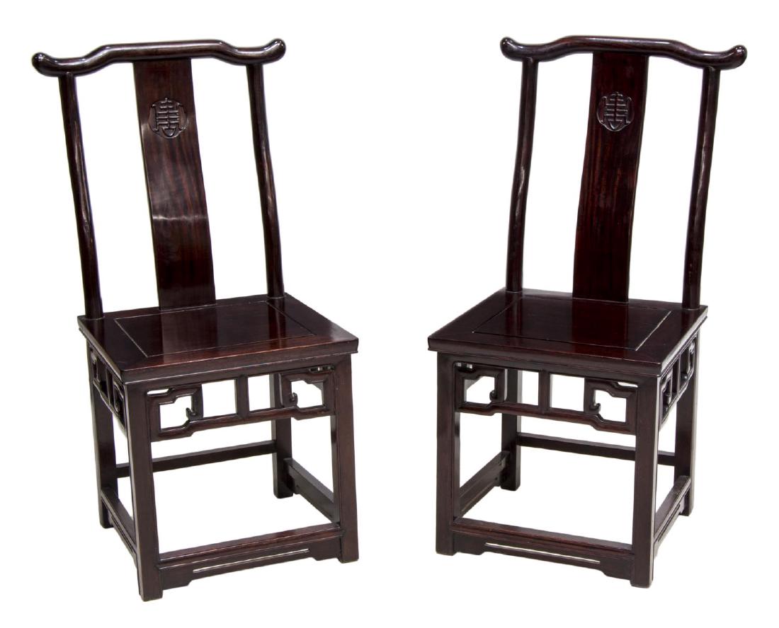 (2) CHINESE CARVED ROSEWOOD SIDE CHAIRS: (pair) Chinese rosewood side chairs, each having central carved splat over solid seat, fret and stretcher base joining four legs, approx 36"h, 16.5"w, 16"d **Provenance: The living estate of Coach Geo