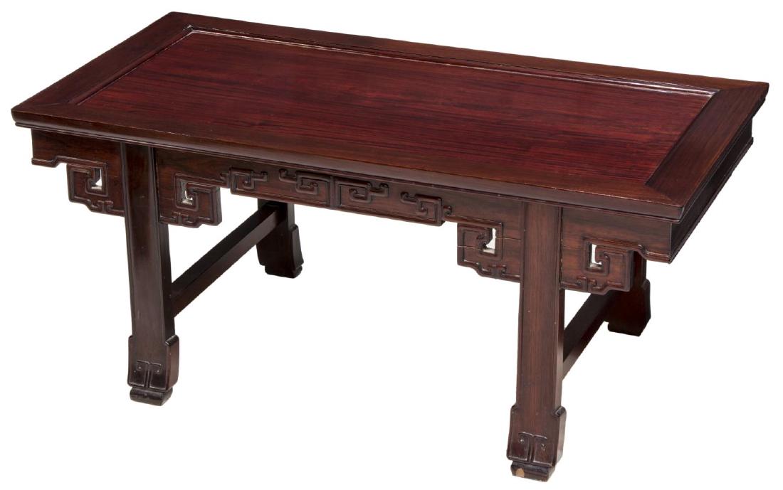 DIMINUTIVE CHINESE CARVED ROSEWOOD COFFEE TABLE: Diminutive Chinese rosewood coffee table, the rectangular top over fret carved apron on stretcher joined legs, 16"h, 36"l, 18"w **Provenance: The living estate of Coach George Hannon (Kemp, Texas, b. 