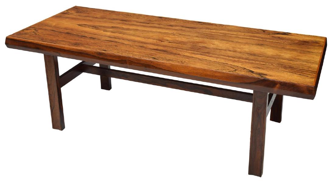 DANISH MID-CENTURY MODERN ROSEWOOD COFFEE TABLE: Danish mid-century modern rosewood coffee table, 1960's, the rectangular top raised on dark rosewood stretcher joined squared legs, 21.75"h, 63.5"lw, 28"d Start Price: $80.00