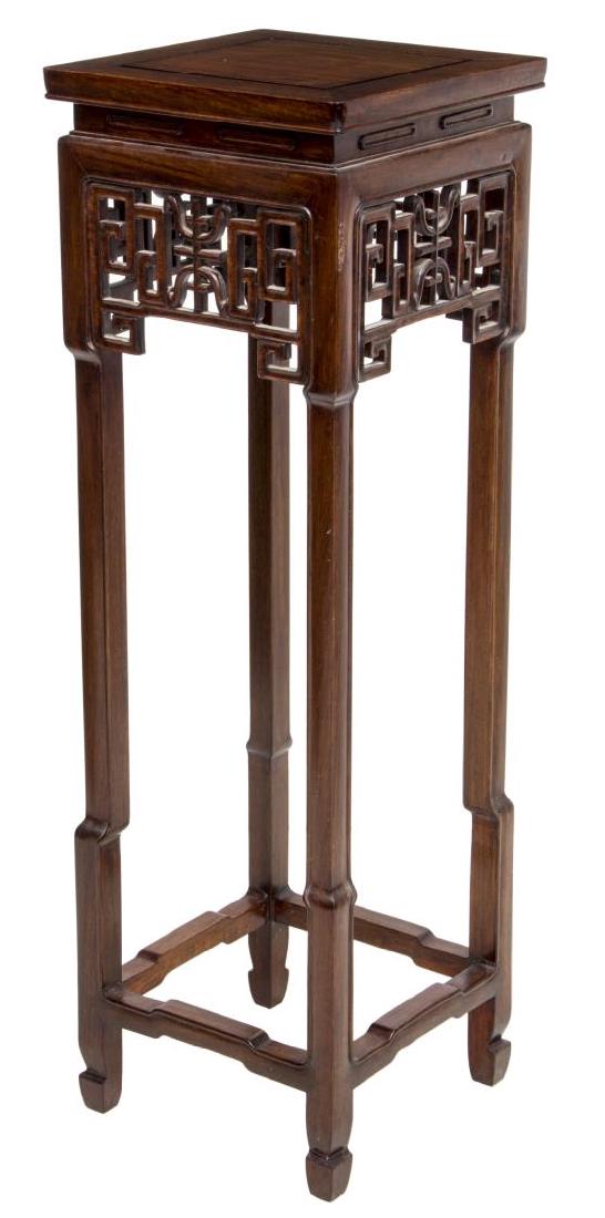 CHINESE CARVED ROSEWOOD PEDESTAL: Chinese rosewood pedestal, having square top over fret and symbol carved apron, four legs joined by lower stretchers, stain to top, 37"h, 11.75"sq **Provenance: The living estate of Coach George Hanno