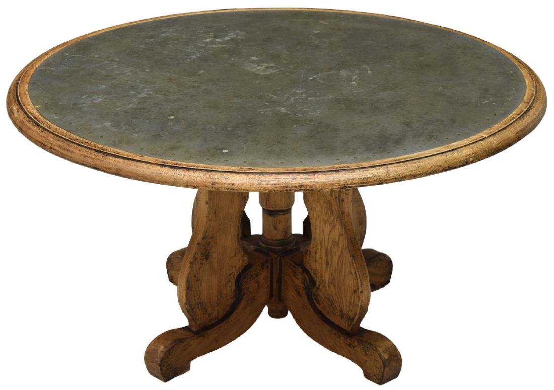ARHAUS WOOD & METAL TOP COFFEE TABLE: Coffee table by Arhaus Furniture Company, the circular top with metal enter and stepped edge raised on four part base with scrolled feet, makers tag at underside, 19"h, 36" diameter Start Price: $100.