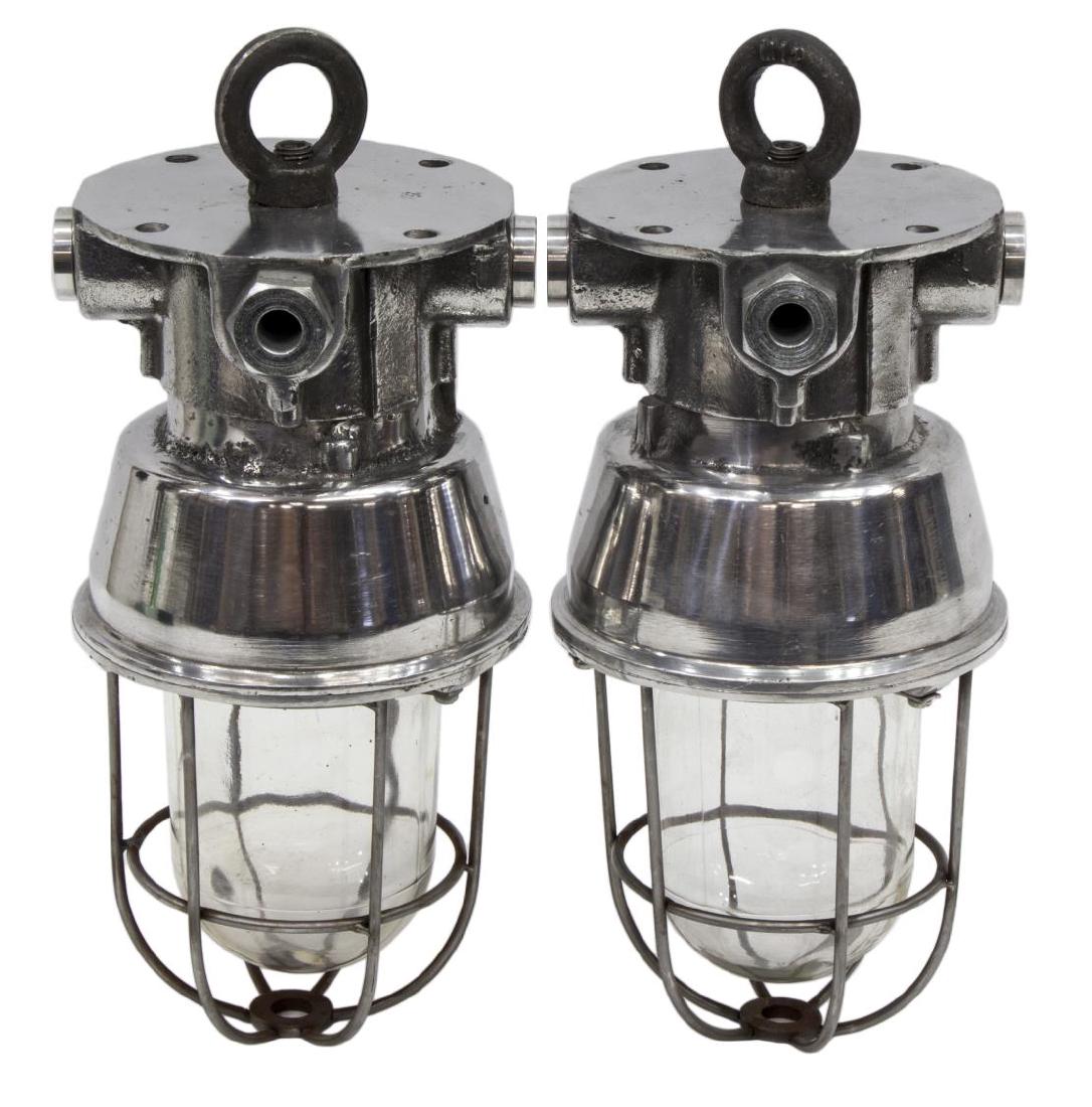 (2) INDUSTRIAL STYLE ALUMINUM CAGED PENDANT LAMP: (lot of 2) Industrial style aluminum caged pendant lights, modern, cage enclosing glass cover and single socket, in need of wiring, iron ring hanger, approx 13.5"l, 10.75lbs