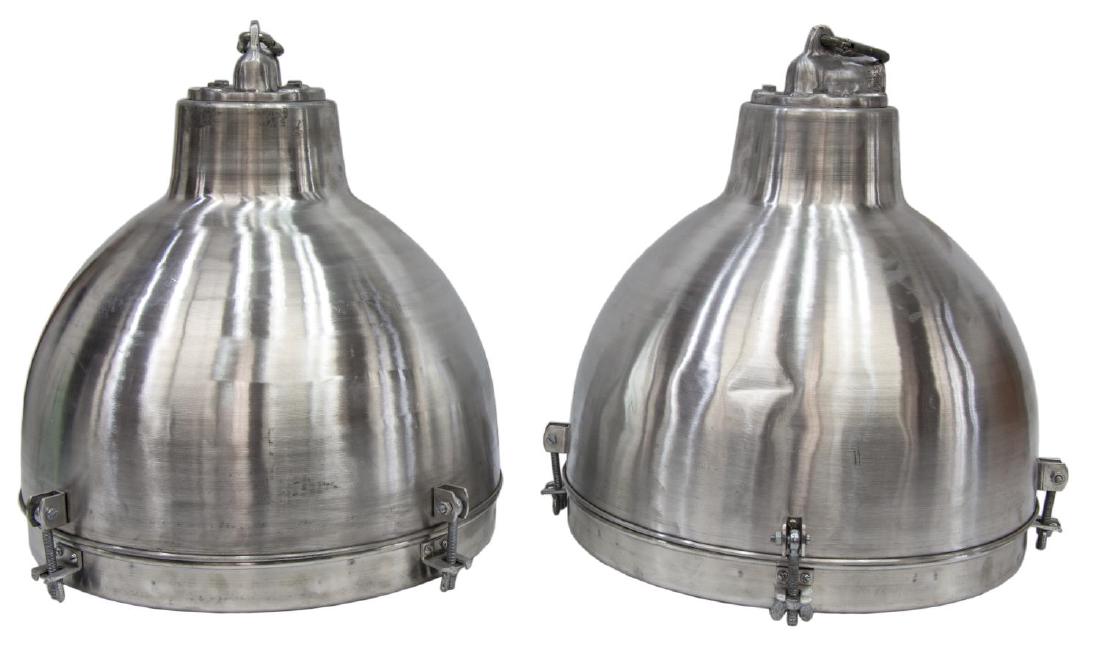 (2) INDUSTRIAL STYLE ALUMINUM DOMED PENDANT LAMPS: (pair) Industrial style aluminum domed pendant lights, domed form with glass insert, lacking socket, in need of wiring, one with crease/dent, approx 17"h, 15.5"w, 15.5lbs