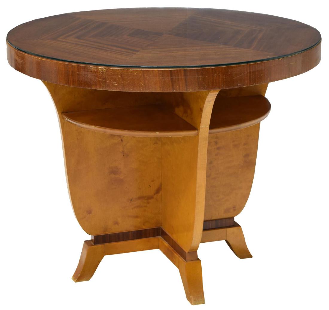 FRENCH ART DECO CIRCULAR TOP COFFEE TABLE: French Art Deco mahogany and birch coffee table, 1930's, a circular top with later glass above a segmented lower tier and supports, rising on outward thrust tapered feet, 25.5"h, 31.5" diameter