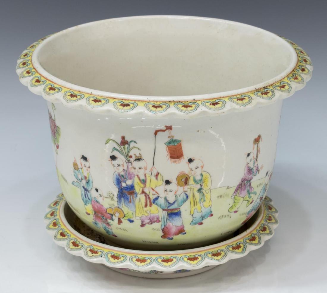 CHINESE FAMILLE ROSE PORCELAIN CHILDREN PLANTER: Chinese famille rose porcelain planter and under tray, polychrome enamel decoration of children with dragon puppet and lanterns, 7"h, 10"diam, 7lbs **Provenance: The living estate of Coach George Hann