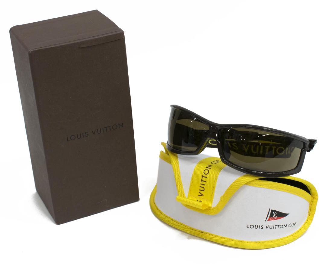 LOUIS VUITTON LIMITED CUP SUNGLASSES IN BOX: Louis Vuitton limited Cup sunglasses with head strap, retaining the original LV case and box, marked Made In Italy, 78-10 / 115, no major scratches, or loss noted to either lens or frame, boxed: 2.75"