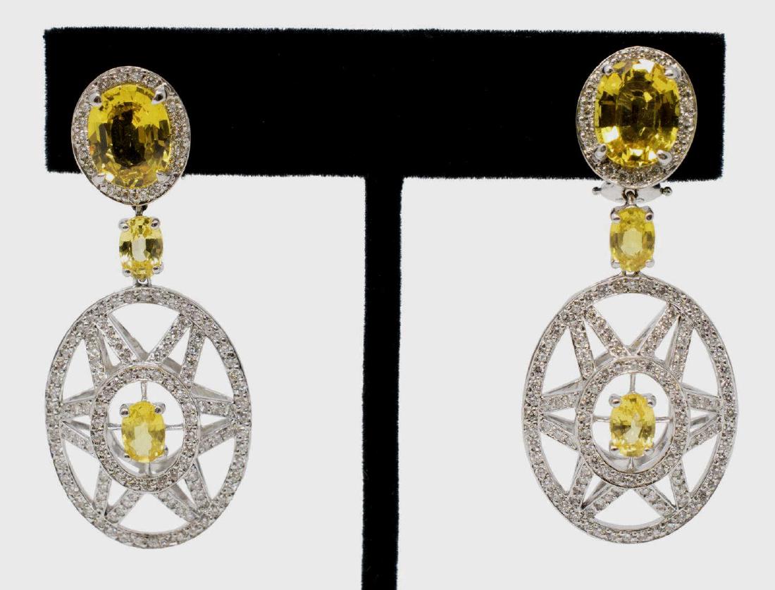 2)LEIBER 18KT, DIAMOND & YELLOW SAPPHIRE EARRINGS: (pair) Judith Leiber 18kt white gold and approx 2.00cttw diamond estate earrings, each centering an yellow sapphire, stylized openwork star dangles, French clip backing, signed Lieber, marked 18kt, ap