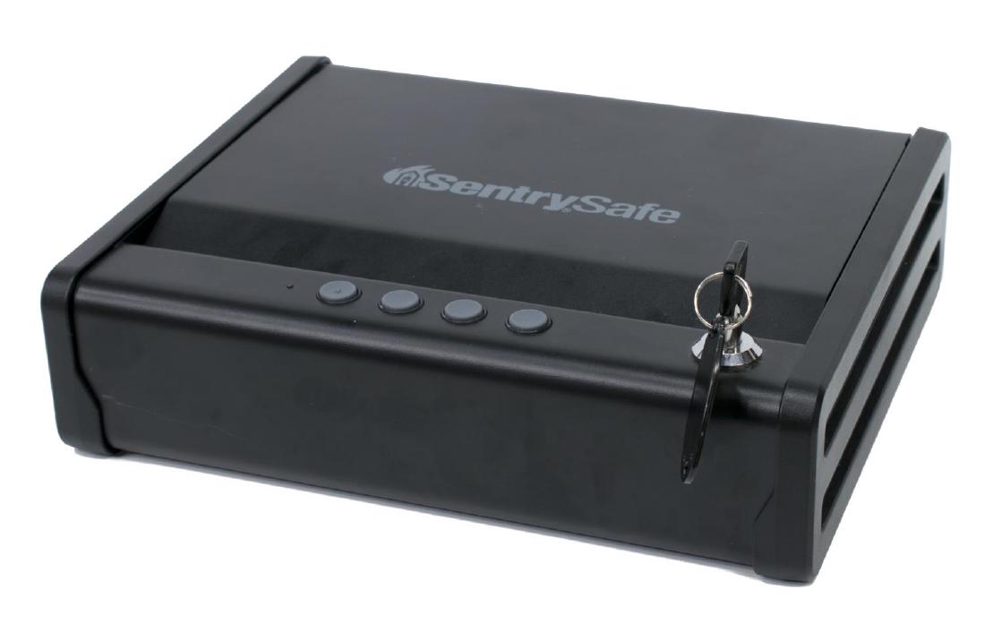 SENTRY ELECTRONIC PISTOL SAFE: Sentry Electronic quick access pistol safe, battery operated or key entry, copy of owners manual, bolt holes for mounting, 3.25"h, 12"w, 10"d, 11lbs Start Price: $50.00