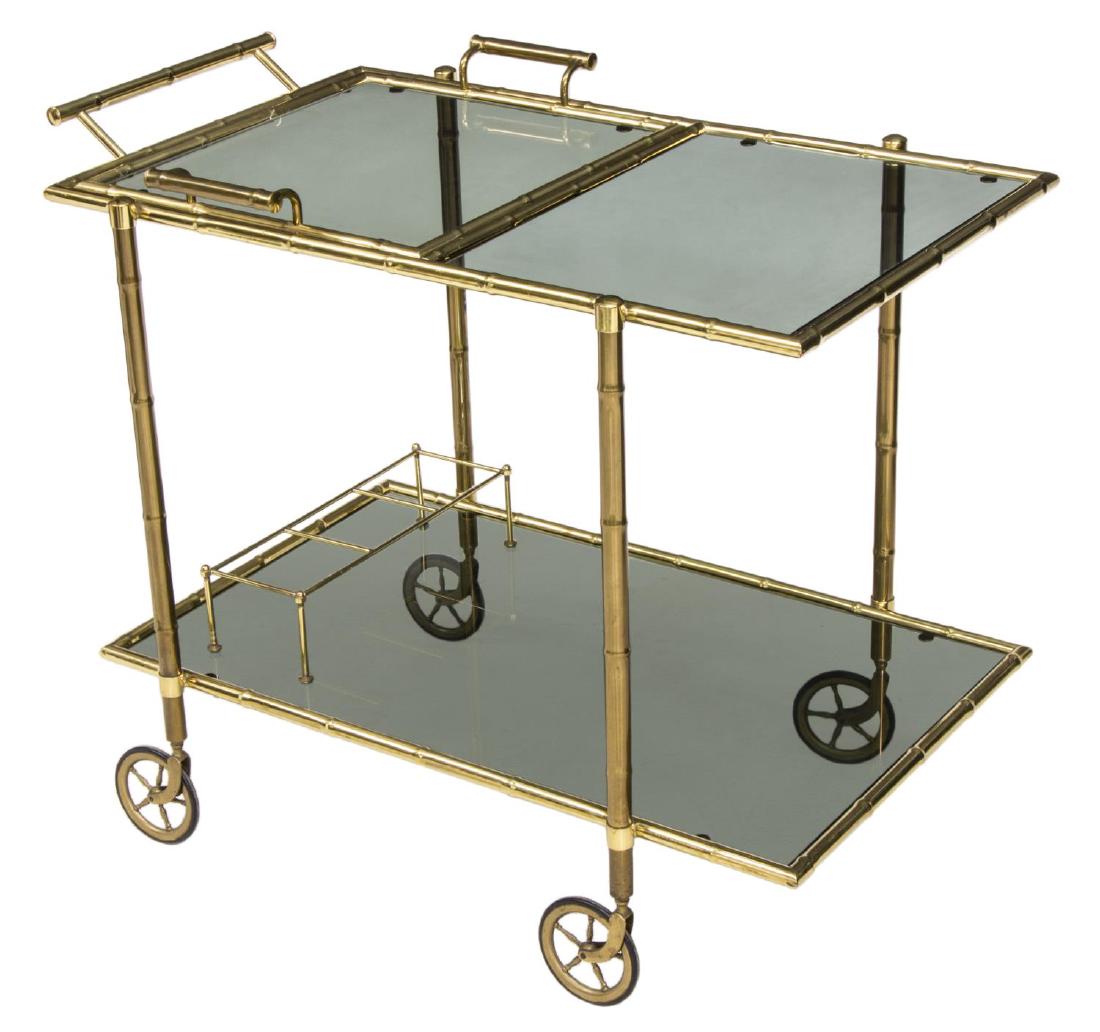 FRENCH MAISON BAGUES BRASS BAMBOO BAR CART: Wheeled bar cart, France, c. 1960, design attributed to Maison Bagues, having gilt brass faux bamboo frame, with smoked glass shelves, bottle holder and removable handled tray, approx 27"h, 32"w, 19.2