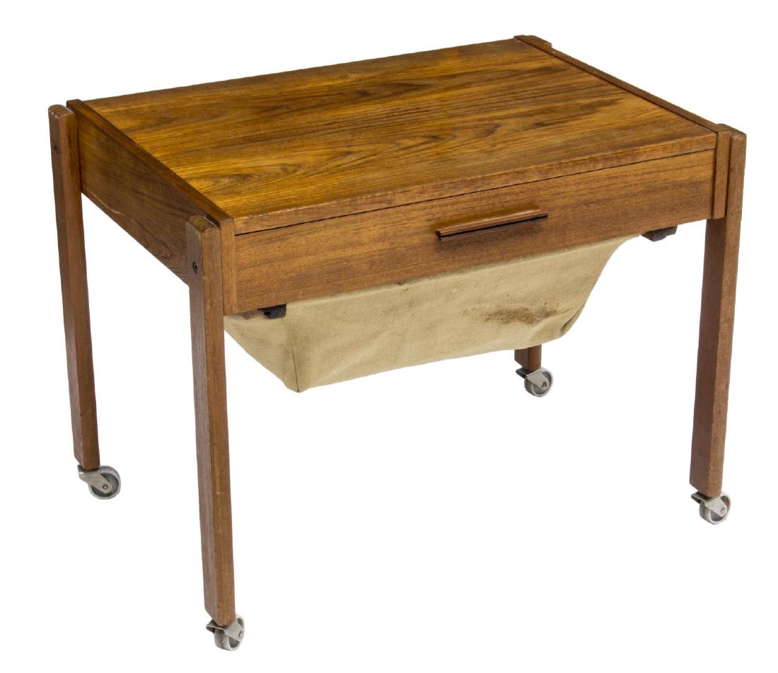 DANISH MID-CENTURY MODERN TEAKWOOD SEWING TABLE: Danish mid-century modern teakwood sewing table, c. 1950's, the rectangular top over a single drawer with divided interior, over a pull-out tray with removable cloth basket, rising on square legs, app