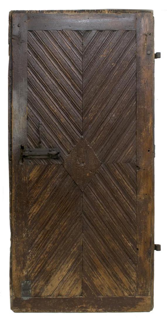 ANTIQUE RUSTIC DOOR, MEXICO: Antique rustic door, possibly Mexico, weathered finish, primitive iron strapping and hardware, remnants of paint, approx 80"h, 39.5"w Start Price: $100.00