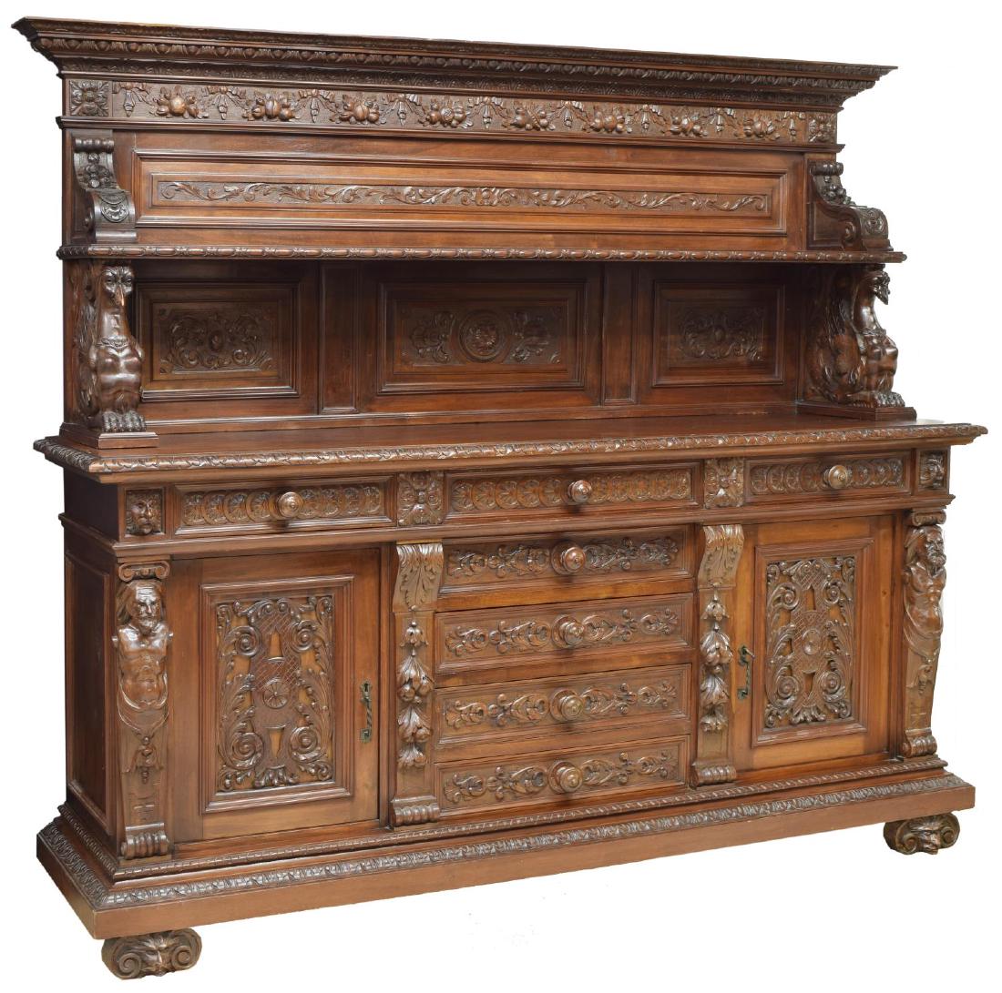 ITALY RENAISSANCE REVIVAL HIGHLY CARVED SIDEBOARD: Italian Renaissance Revival sideboard, early 20th c., having stepped corniced top, over carved fruit and scrolling foliate frieze and shelved back, scrolled brackets with winged harpies, above three f