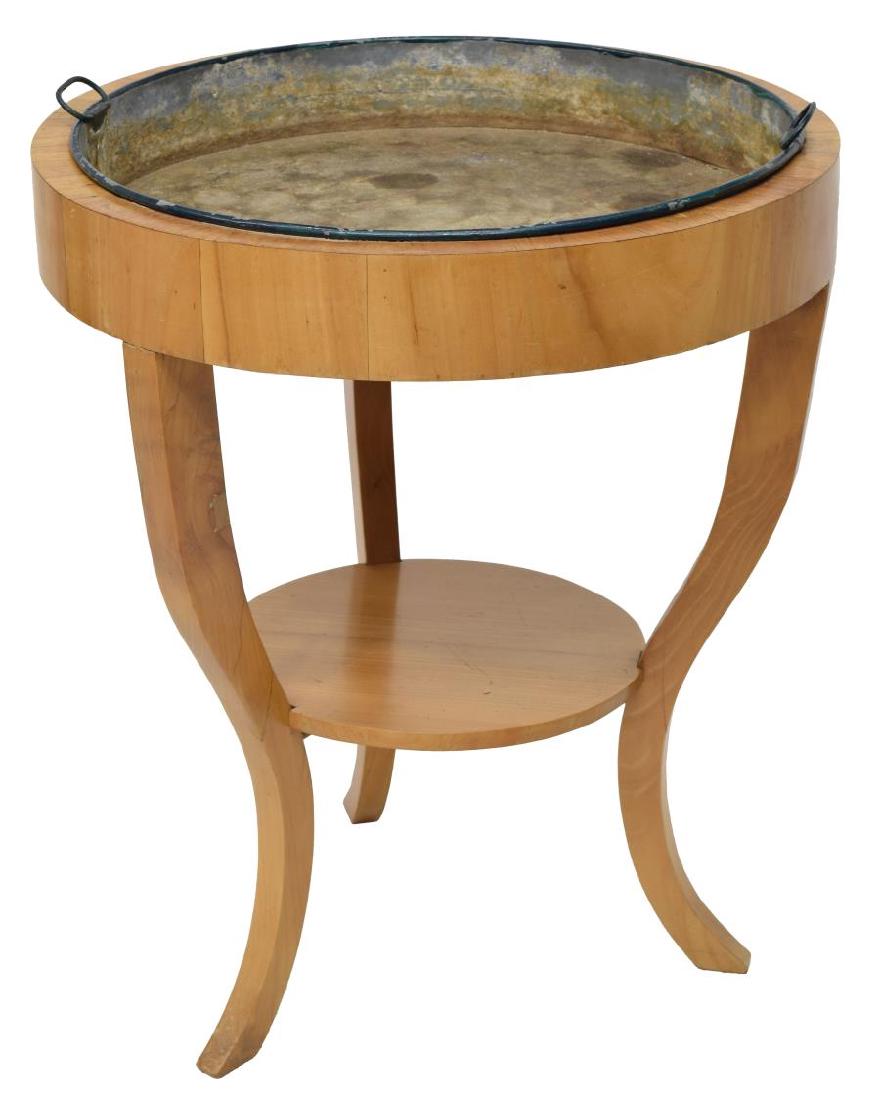BIEDERMEIER CHERRY FLOWER TABLE: Biedermeier cherry veneer flower table, 19th c., having a circular top with removable metal insert, curving legs joined by a lower shelf, 26.5"h, 23" diameter *Provenance: from a private Austin estate
