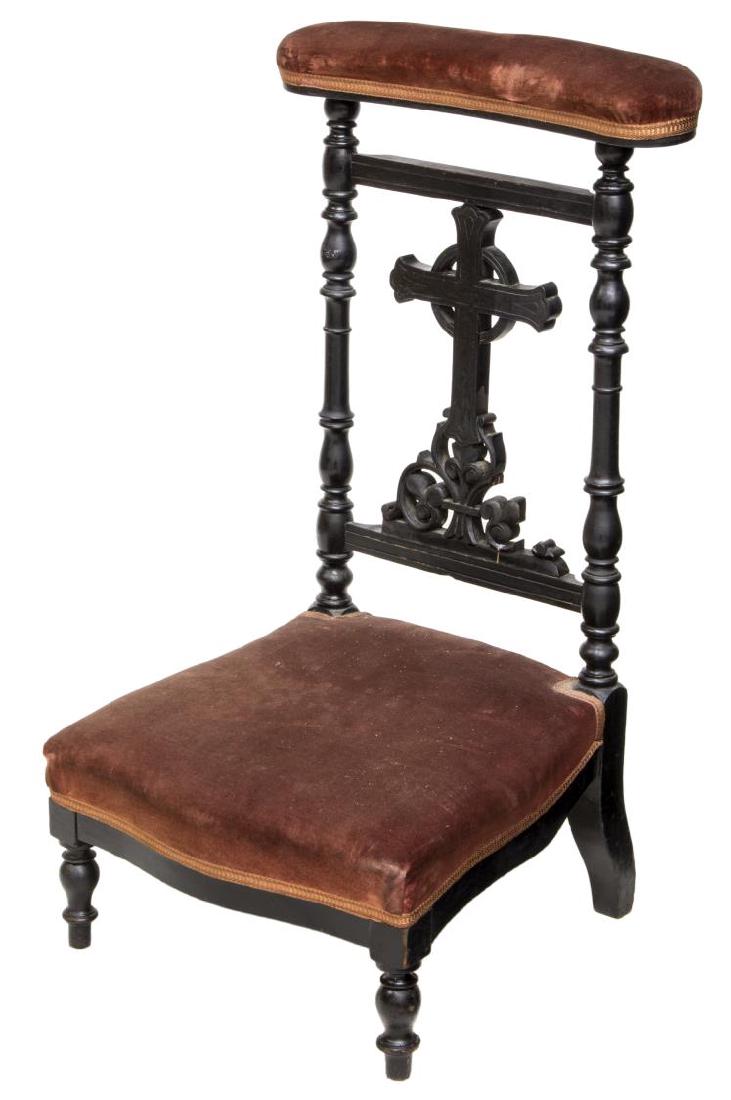 FRENCH CROSS CARVED PRAYER CHAIR / KNEELER: French prayer chair / kneeler, 19th c., having wood frame with ebonized finish, padded top rail, over back splat with carved cross, padded seat in matched upholstery, rising on short turned front legs