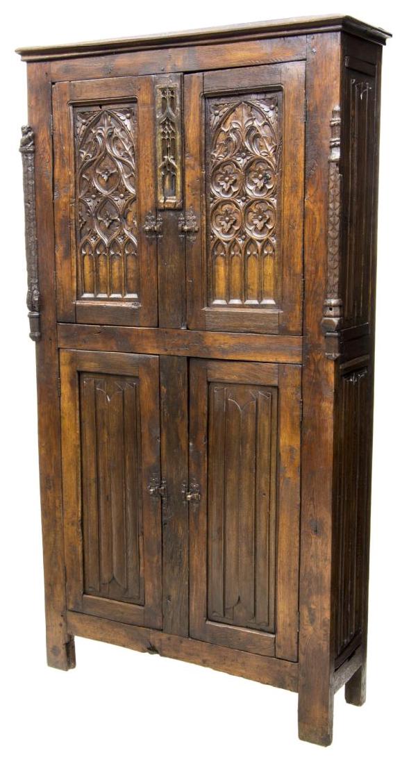 FRENCH GOTHIC STYLE CUPBOARD: French Gothic style oak cupboard, 18th c. with later restoration and embellishment, decorated with carved quatrefoils, tracery, arches, floraland linen fold panels, two upper doors over two lower door