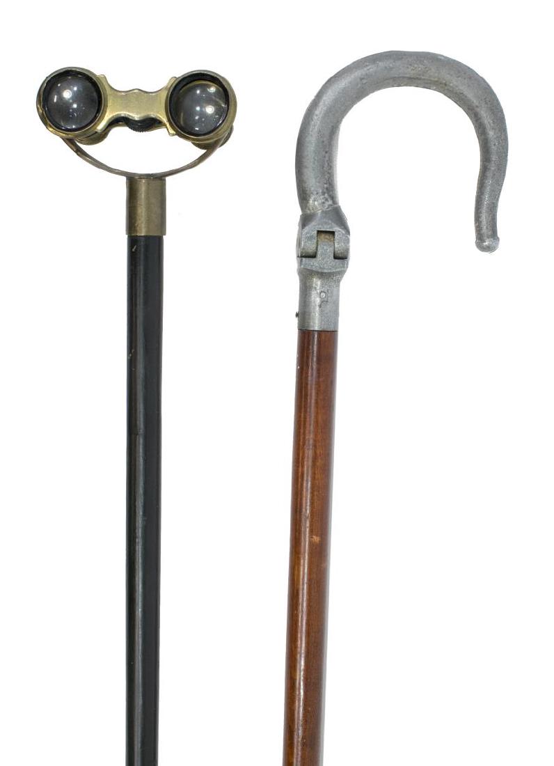 (2) WALKING STICK WITH OPERA GLASSES & CANE SEAT: (lot of 2) Walking sticks, including: (1) Brass opera glasses walking stick, England, c. 1890-1990, with ebony shaft, ending in brass cap, old resoldering restoration, approx 35.5"l; (1) cane chair, a