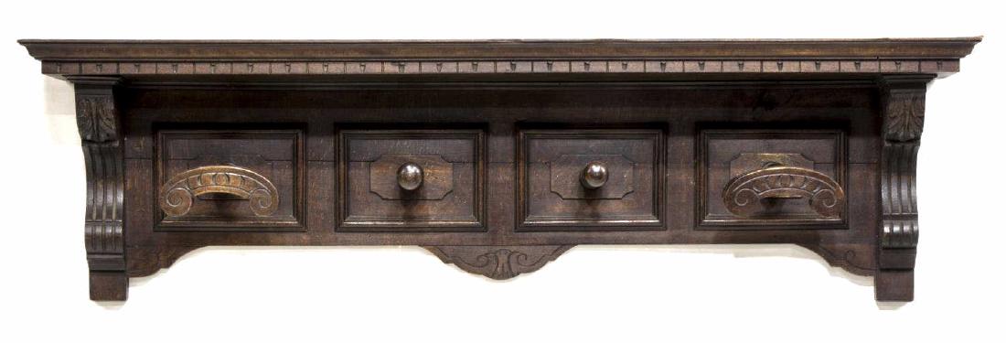RENAISSANCE REVIVAL CARVED WOOD WALL HAT RACK: Renaissance Revival wall hat rack, 19th c., cornice protruding over four hooks, shell form hooks at ends, carved scroll accents, retaining two metal wall hooks, approx 12.25"h, 47"w, 7.5"d Start Price