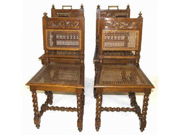 SET OF 4 FRENCH ANTIQUE TWIST OAK BEDROOM CHAIRS: A set of four French antique twist oak bedroom chairs. Each about 37.25"x18"x16.75". Two with cane damage to seat, two with damage to finials.