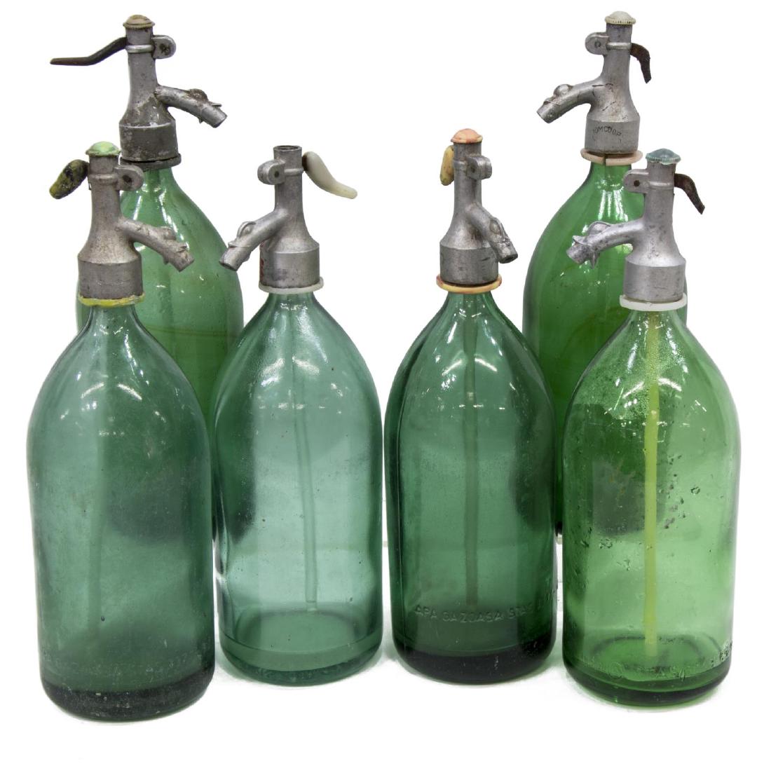 (6) VINTAGE SODA SIPHON SELTZER GREEN GLASS BOTTLE: (lot of 6) Vintage soda siphon seltzer bottles, 20th c., with green glass bottle, some with loss, approx 13.5"h, 4"diam, 19lbs total Start Price: $60.00