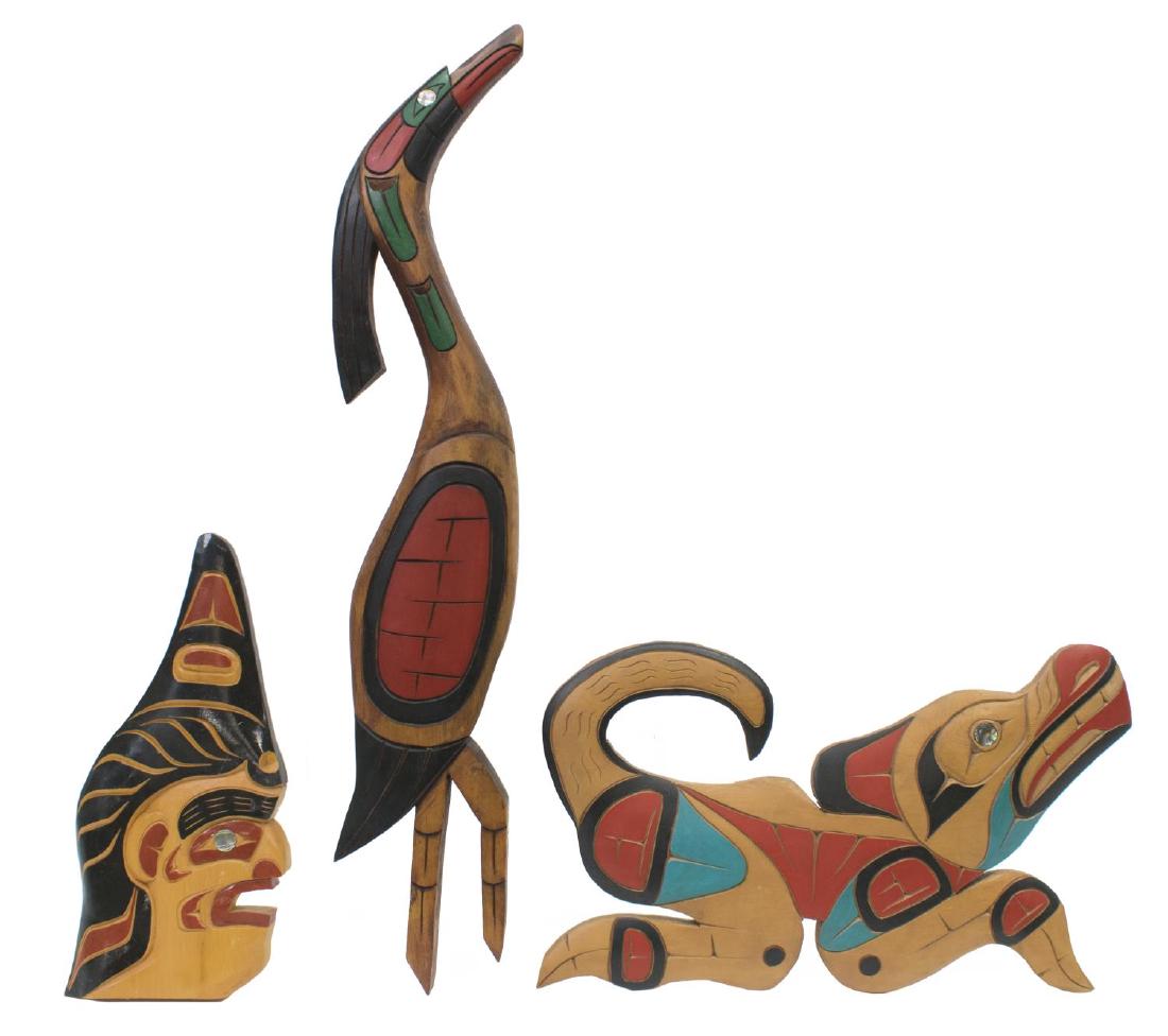 3) VINTAGE NORTHWEST COAST ABALONE & WOOD CARVINGS: (lot of 3) Vintage Northwest Coast figural carved plaques, all polychrome painted with inset abalone eyes and accents: (1) running figure of a wolf, signed Alfred Cocker, approx 9.25"h, 15.5"l; (1) st