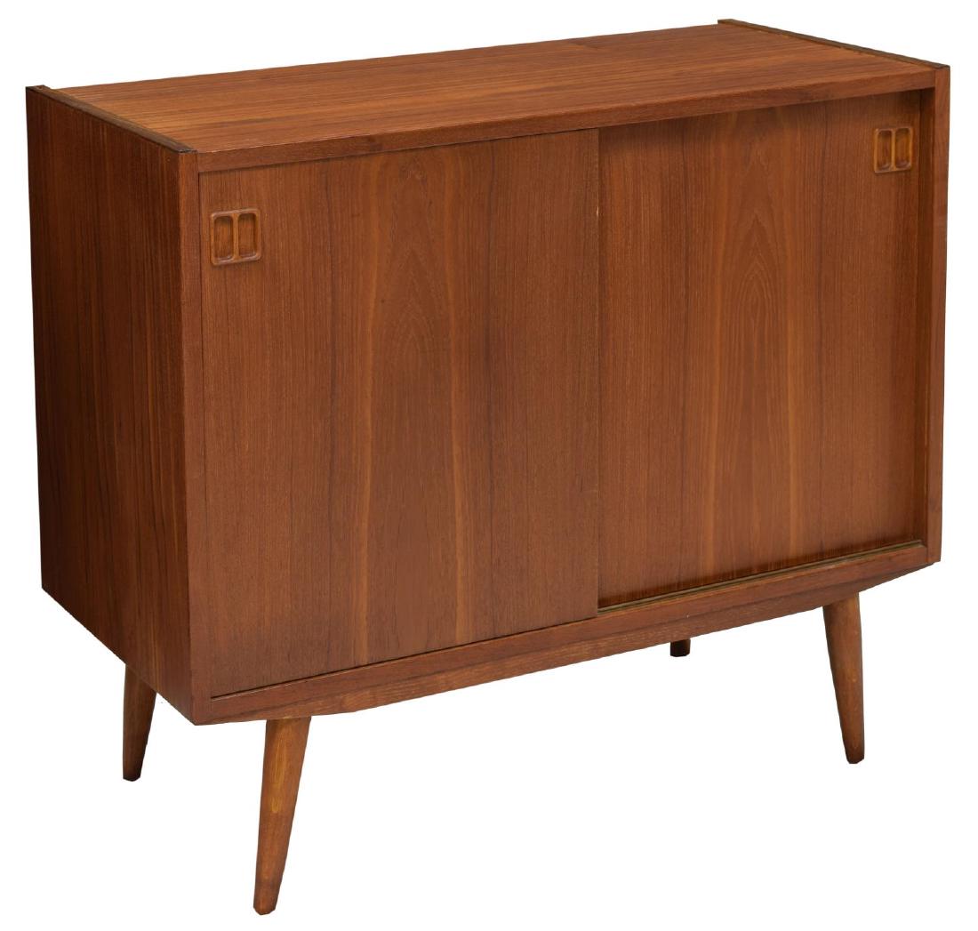 DANISH MID-CENTURY MODERN TEAKWOOD CABINET: Danish mid-century modern teakwood cabinet, 1950's, two sliding doors open to shelves, rising on tapered turned legs, 31"h, 34.25'w, 17"d Start Price: $100.00