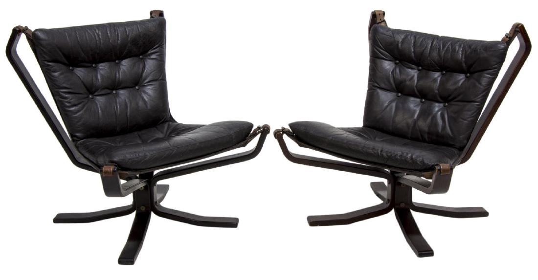(2) SIGURD RESSELL FALCON BLACK LEATHER CHAIRS: (lot of 2) Norwegian modern Falcon chairs, design by Sigurd Ressell (1920-2010) for Vatne Mobler, buttoned black leather one piece seat and back suspended by leather straps over the black bent wood fr
