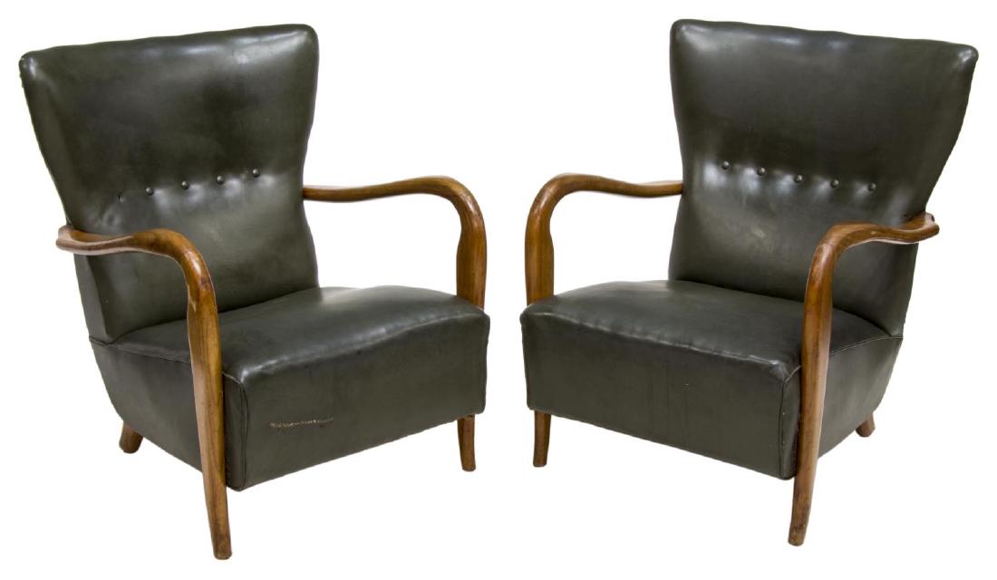 (2) PAOLO BUFFA (ATTRIB.) ITALIAN MODERN ARMCHAIRS: (pair) Italian mid-century modern wingback armchairs, c. 1950, design attributed to Paolo Buffa (Italy, 1903-1970), green vinyl upholstery with button back, over sculptural oak arms, rising on turned