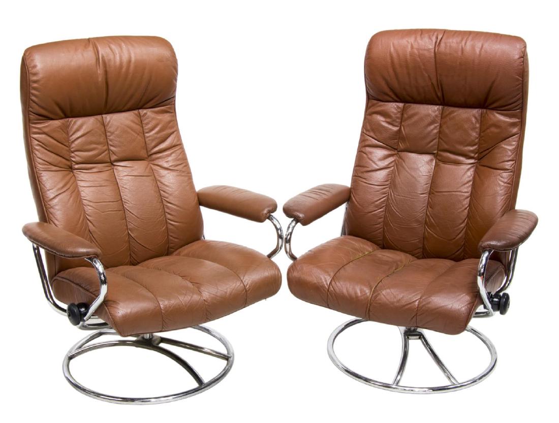 (2) DANISH MODERN LEATHER RECLINER LOUNGE CHAIRS: (pair) Danish modern lounge chairs, c. 1970, chromed steel frame, with brown leather seat, back, padded head and arm rests, swivel base with recline function, some creasing to leather, approx 40"h, 29
