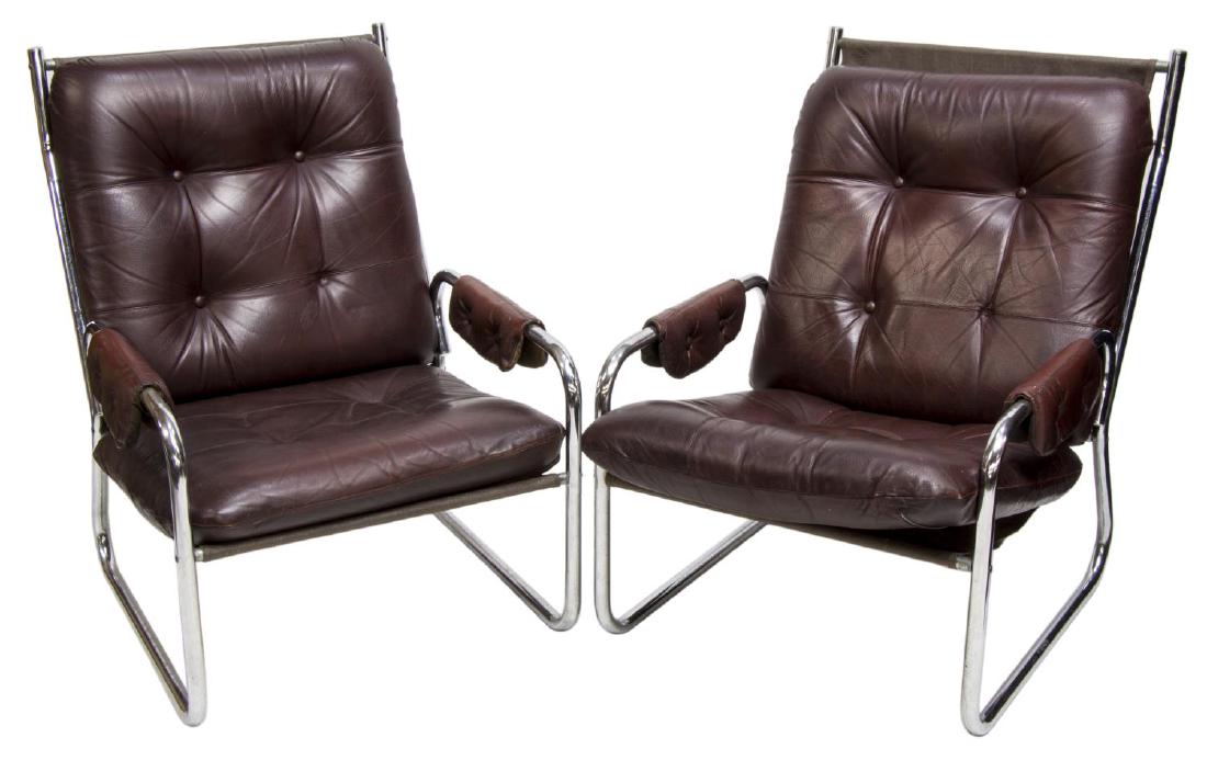 (2)DANISH MID-CENTURY MODERN LEATHER LOUNGE CHAIRS: (lot of 2) Danish mid-century modern lounge chairs, 1960's, chromed steel framed surrounding brown buttoned leather upholstery, 35"h, 25"w, 26"d Start Price: $250.00
