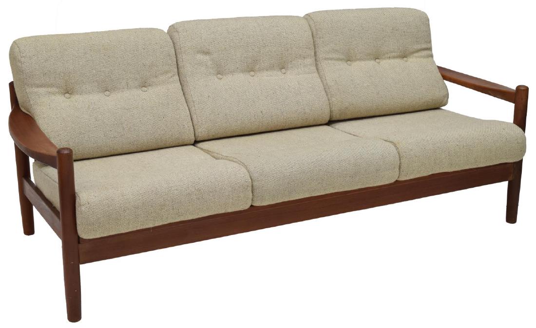 DANISH MID-CENTURY MODERN TEAKWOOD SOFA: Danish mid-century modern sofa, c. 1950's, teakwood straight backed frame, with slightly curved armrests, having beige upholstered buttoned cushions, rising on turned tapered legs, slight spotting to 