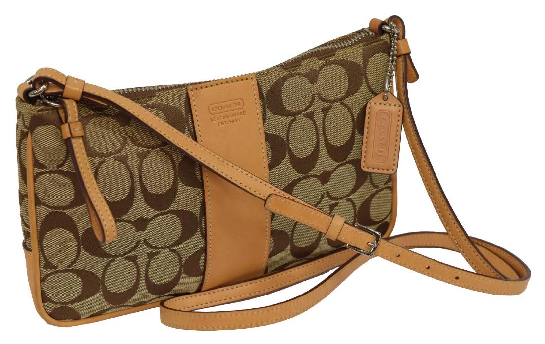 COACH BROWN TAN MONOGRAM CANVAS SLING BAG: Coach brown monogram canvas sling bag, tan leather accents, silver tone hardware, adjustable sling strap, zipper closure, orange fabric interior lining, single flat pocket to interior, slight wear and